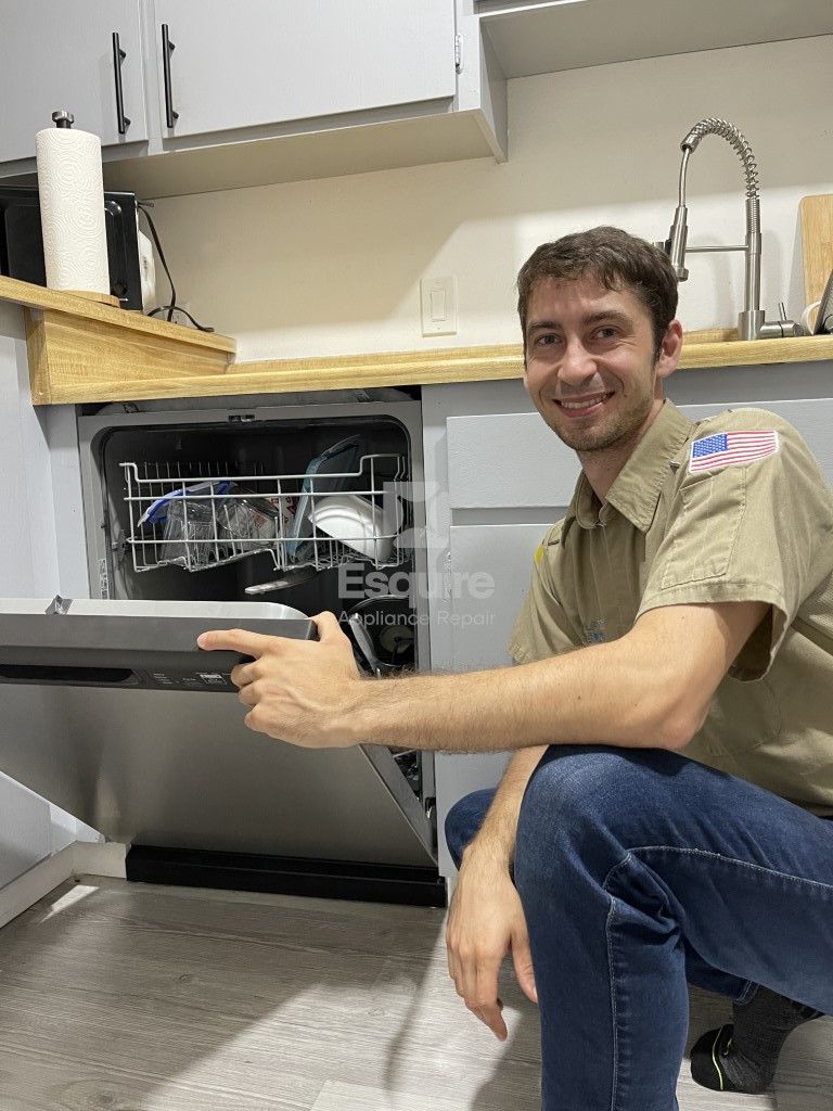 Esquire Appliance Repair technician working on a dishwasher in Orange County