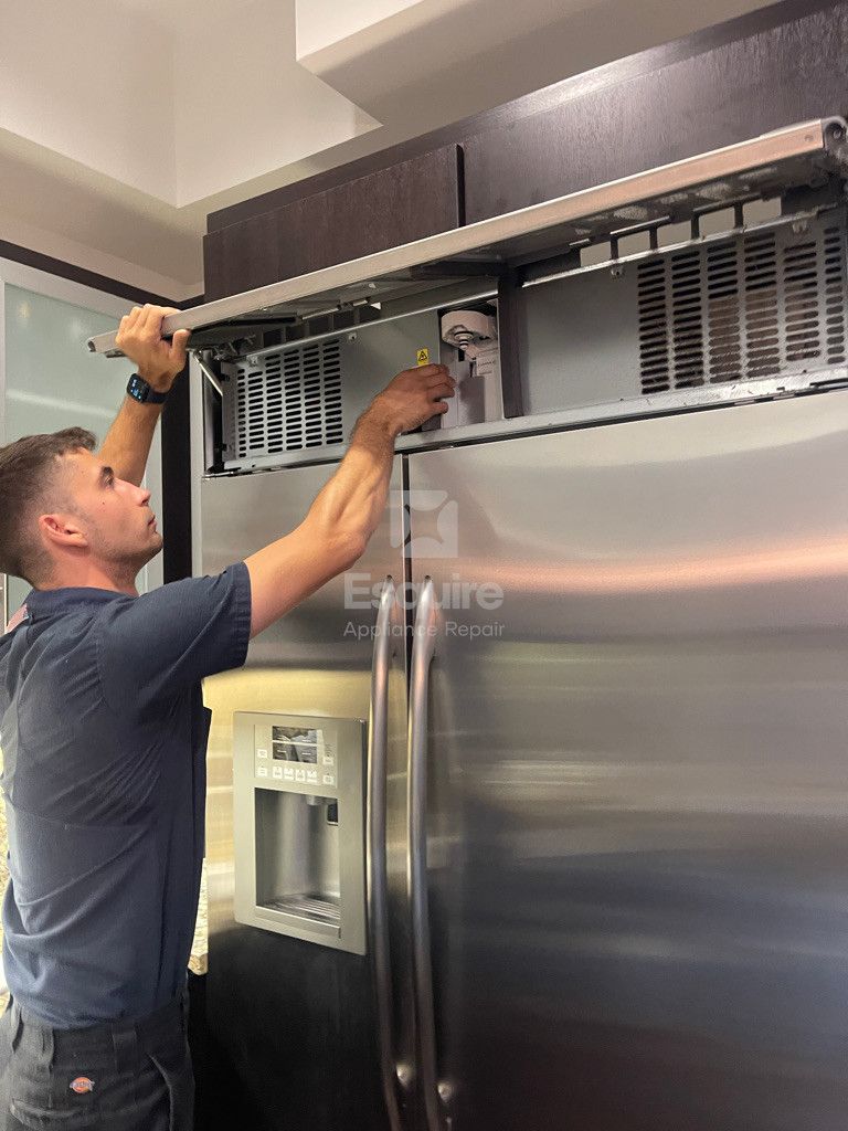 Esquire Appliance Repair technician working on a refrigerator in Orange County