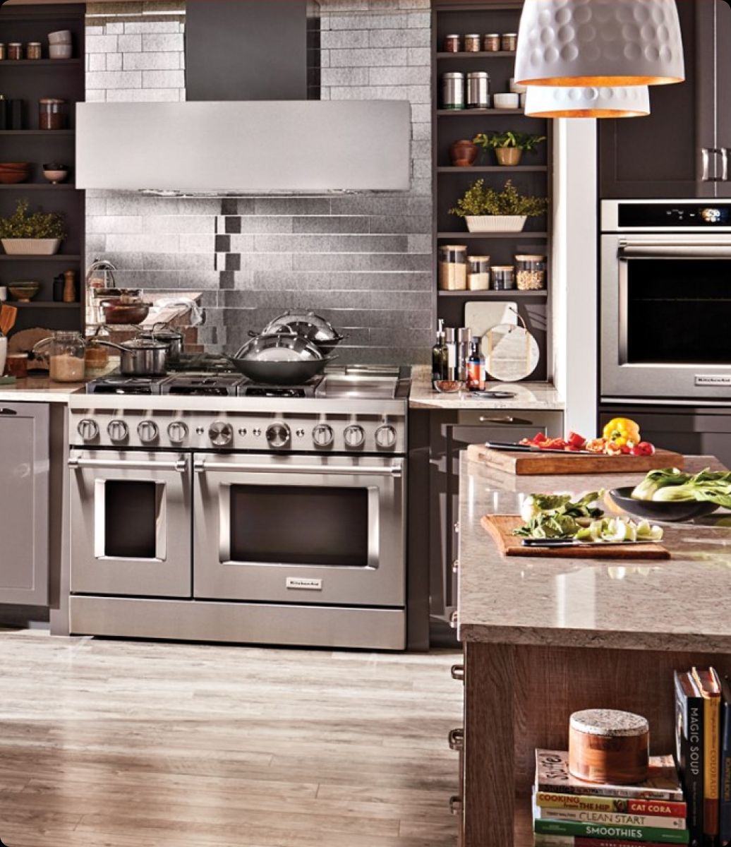 Esquire Appliance Repair technician servicing a KitchenAid appliance in Orange County