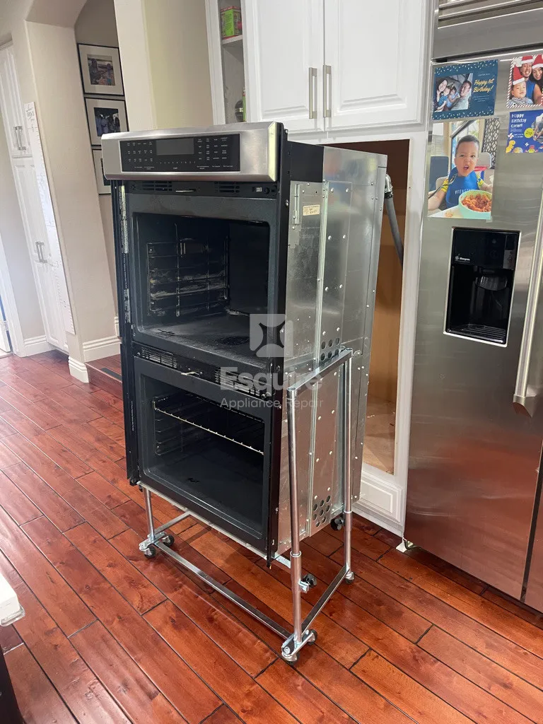 Wall oven with the door open showing racks and interior