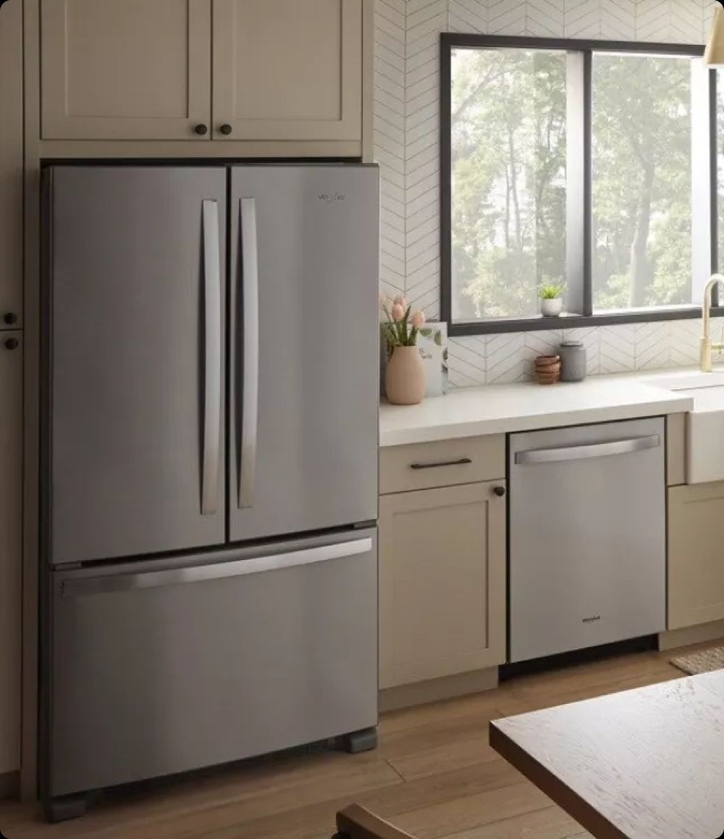 Esquire Appliance Repair technician servicing a Whirlpool appliance in Orange County