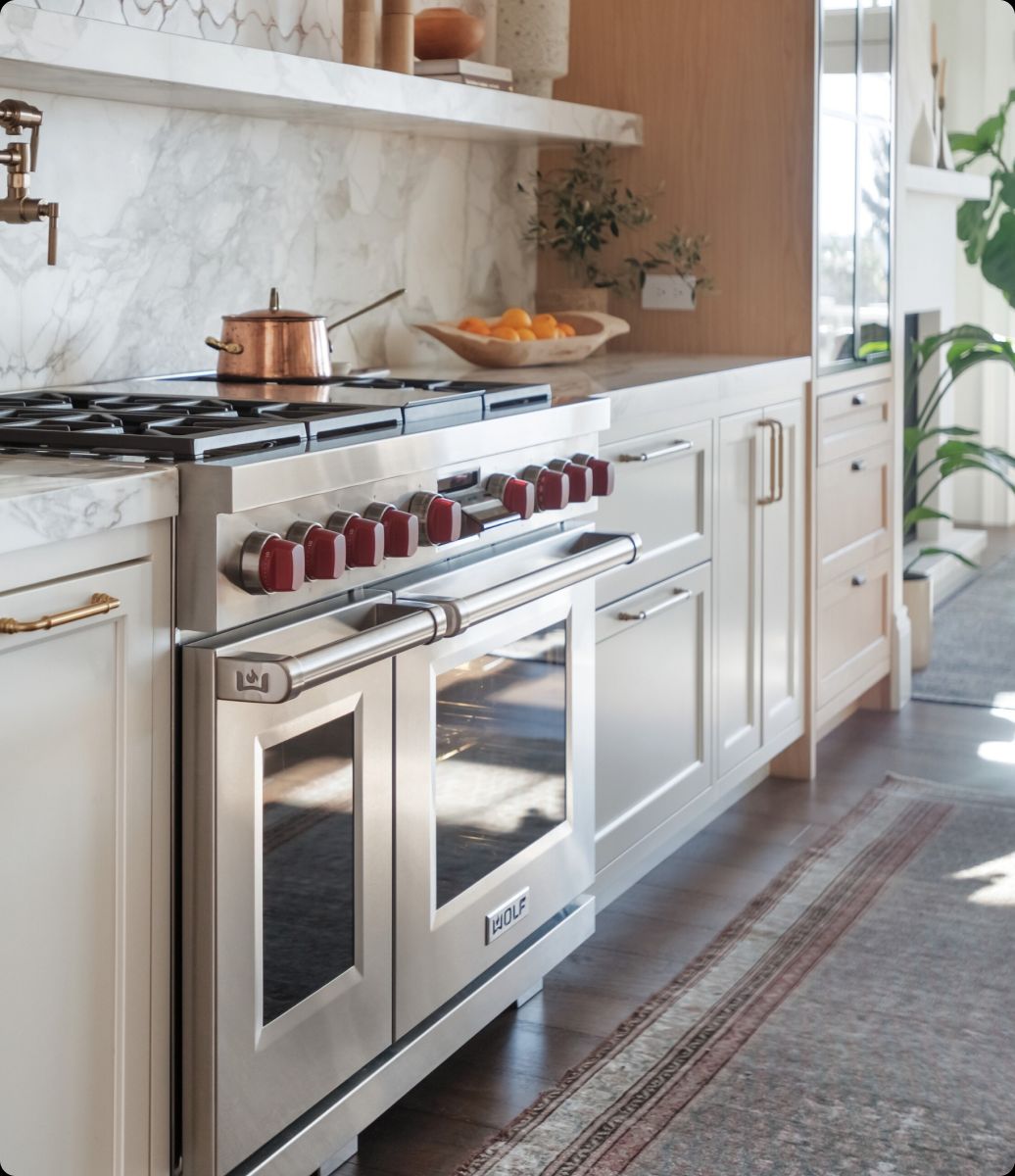 Esquire Appliance Repair technician servicing a Wolf appliance in Orange County